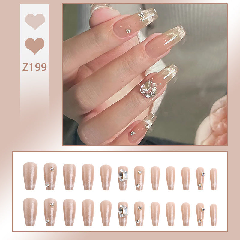 Acrylic nail set with glamorous glitter accents and elegant jewelry embellishments Acalora