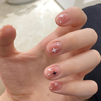 Acrylic nail set with sparkling star decorations and elegant accents Acalora