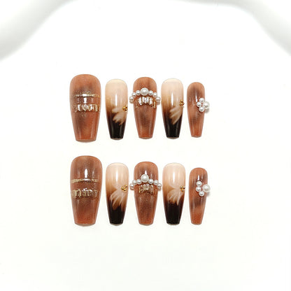 Artificial nails with glamorous gold and pearl embellished accents Acalora