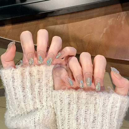 Glamorous artificial nail set with luxurious glitter elements Acalora