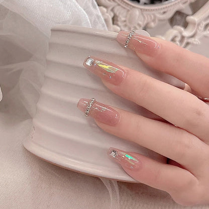 Acrylic nail set with glamorous rhinestone and glitter elements Acalora