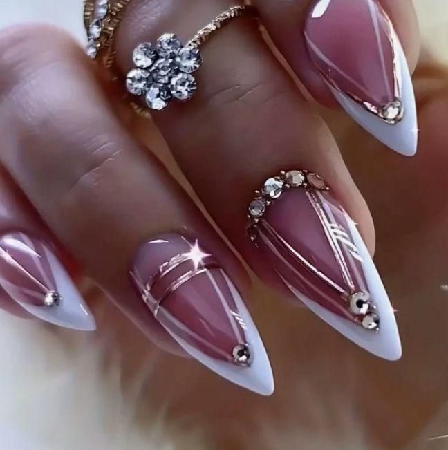 Acrylic nail set with elegant stiletto shape and luxurious embellishments Acalora