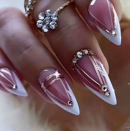 Acrylic nail set with elegant stiletto shape and luxurious embellishments Acalora