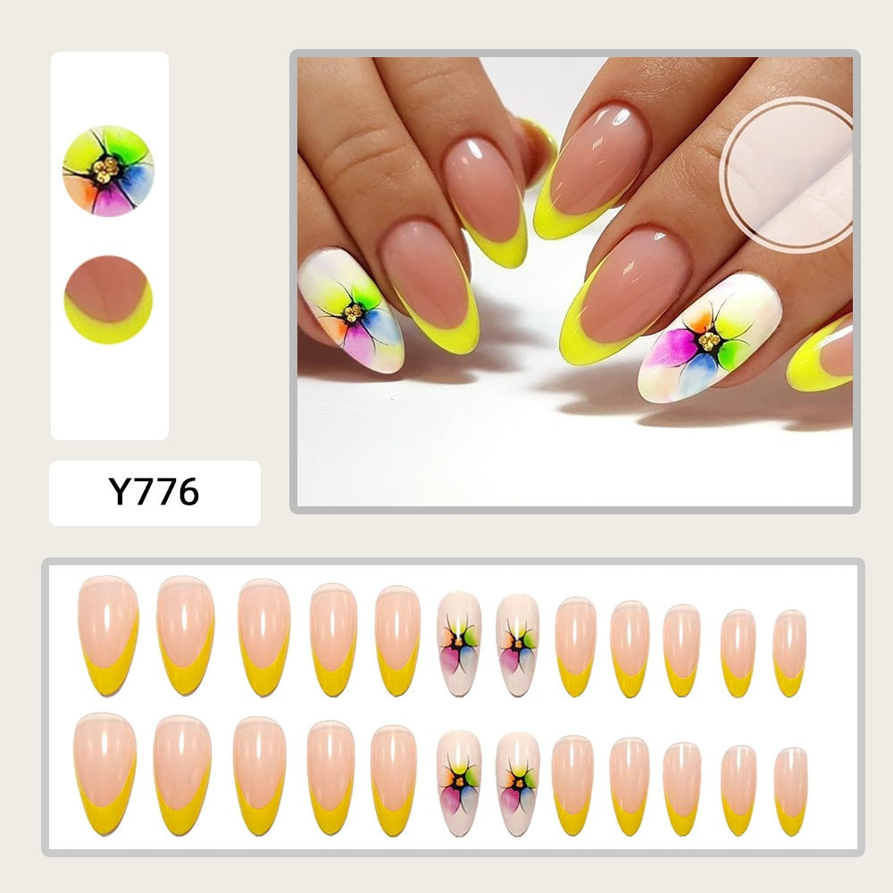 Artificial nails with colorful floral designs and striking color accents Acalora
