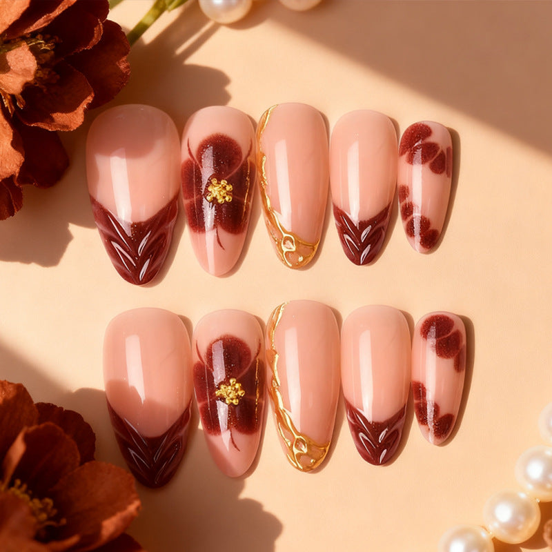 Exclusive artificial nails with floral designs and gold embellishments Acalora