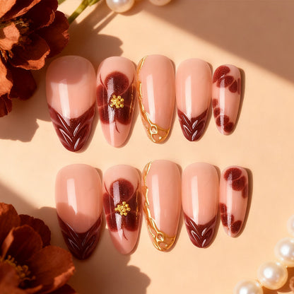 Exclusive artificial nails with floral designs and gold embellishments Acalora