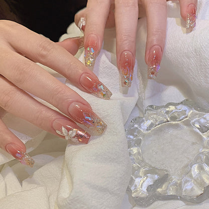 Artificial nail set with floral and glittering accents Acalora