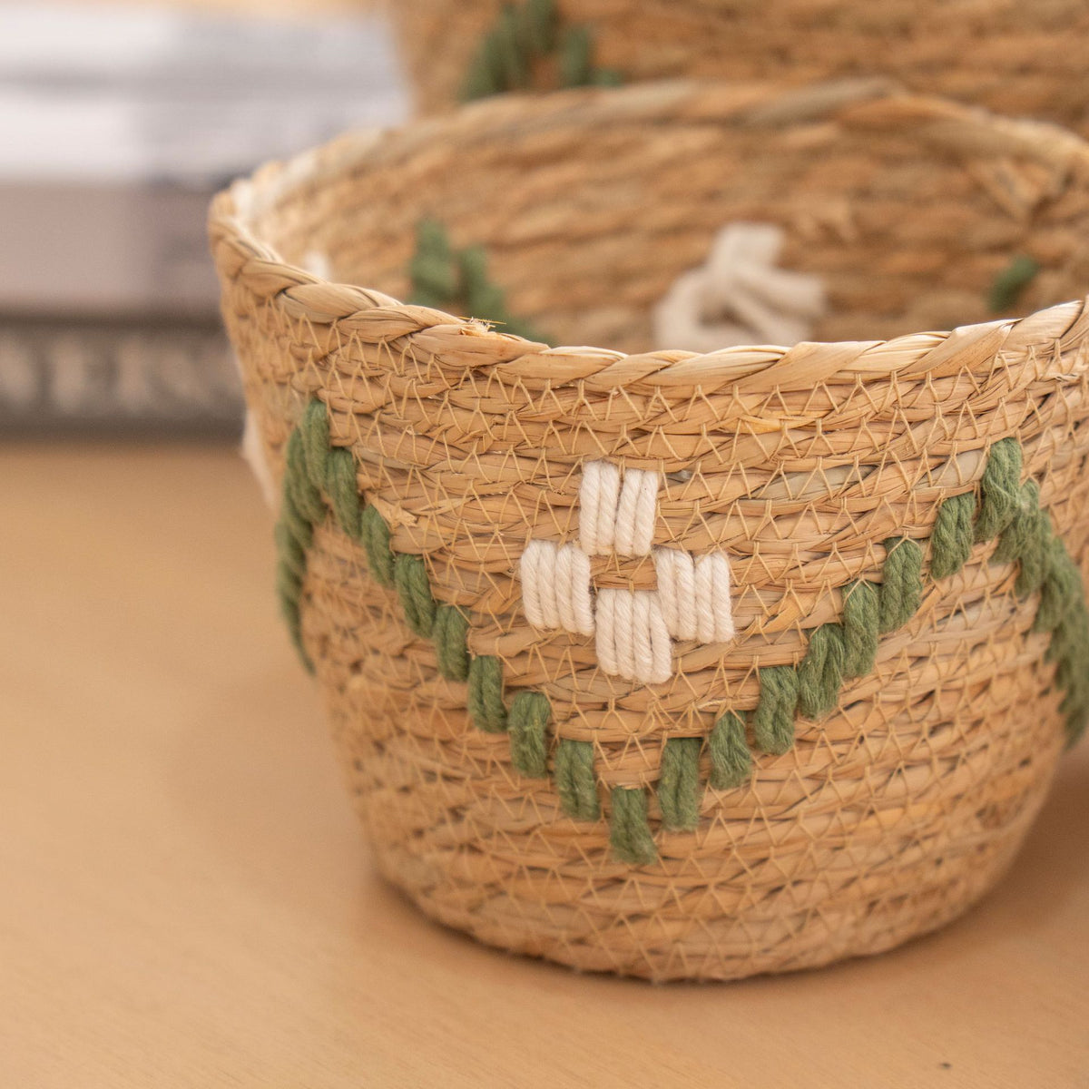Handwoven storage basket with colorful accents Acalora