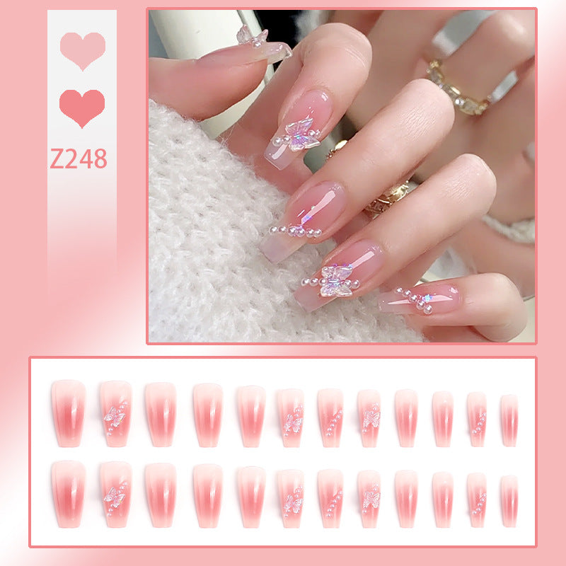 Artificial nails with luxurious pearl and glitter decorations Acalora