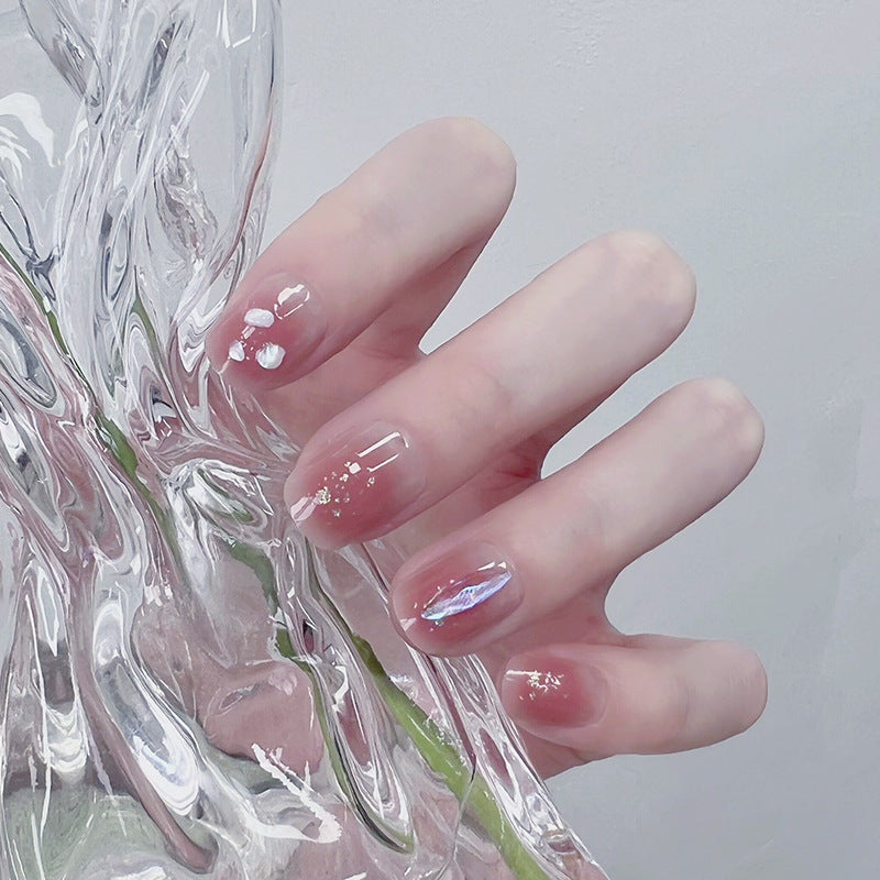 Artificial nails with delicate glitter design and floral accent Acalora