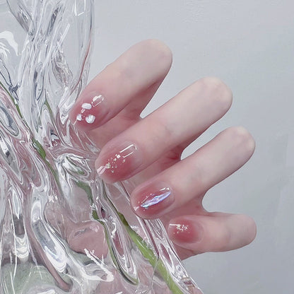 Artificial nails with delicate glitter design and floral accent Acalora