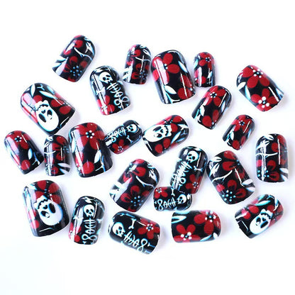 Artificial nail set with creepy skull design and floral accents Acalora
