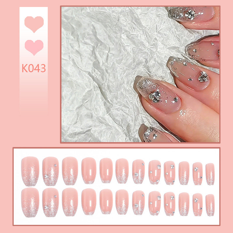 Acrylic nail set with extravagant glitter and crystal embellishments Acalora