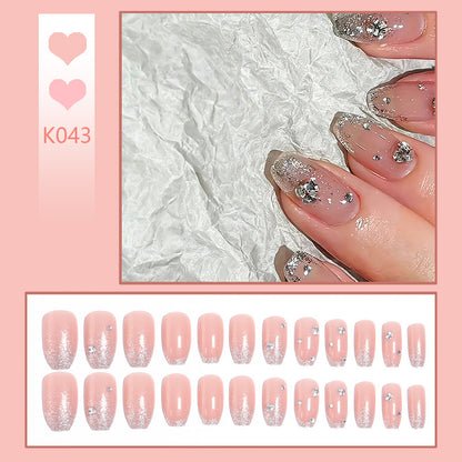 Acrylic nail set with extravagant glitter and crystal embellishments Acalora