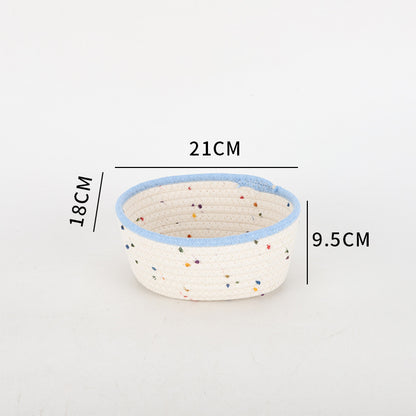 Storage basket made of natural cotton fabric with colorful dots