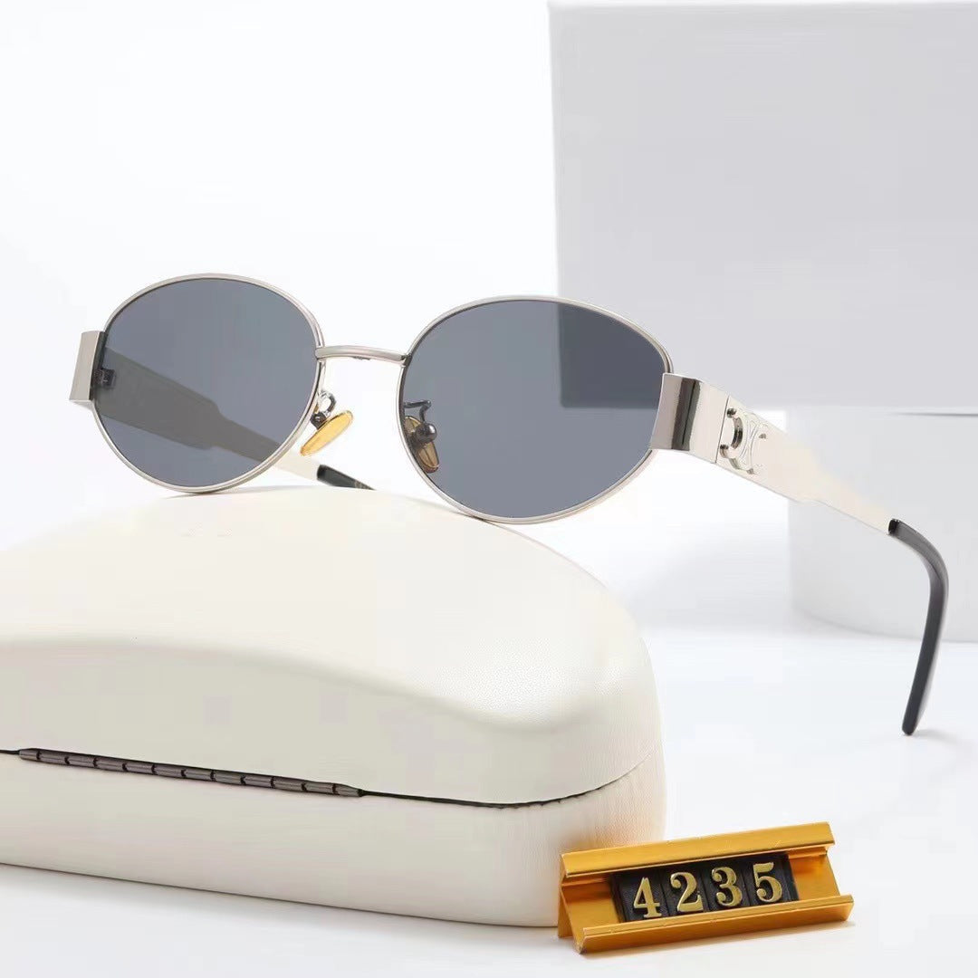 Women's elegant oval sunglasses with gold-colored frame Skanto