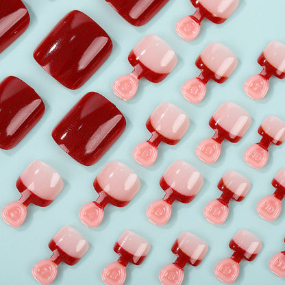 Acrylic nail set in elegant red and nude design Acalora
