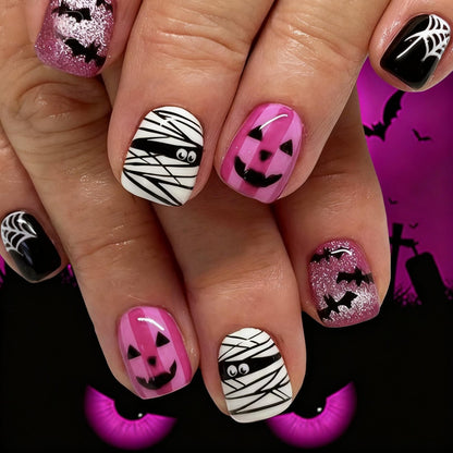 Creative nail art set with Halloween motifs and glitter accents Acalora