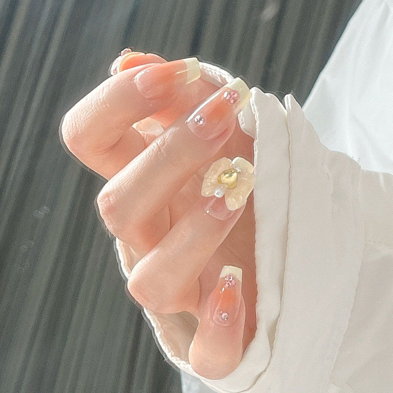 Artificial nail set with elegant floral decorations and glitter accents Acalora