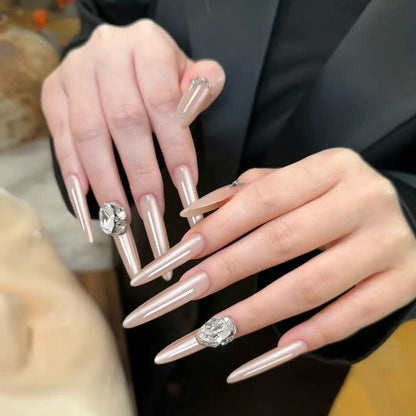 Acrylic nail set with elegant tips and glamorous rhinestone accents Acalora