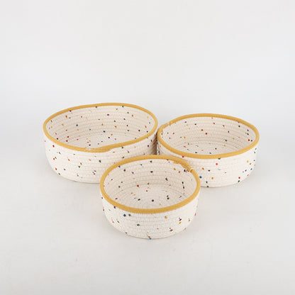Storage basket made of natural cotton fabric with colorful dots