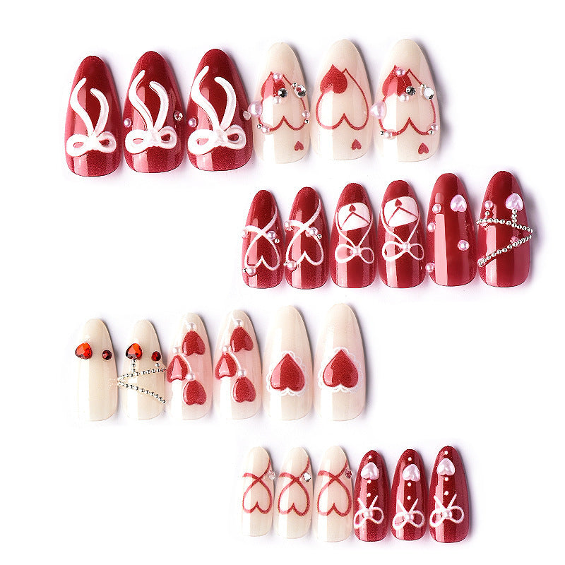 Glamorous artificial nail set with romantic heart design and elegant embellishments Acalora