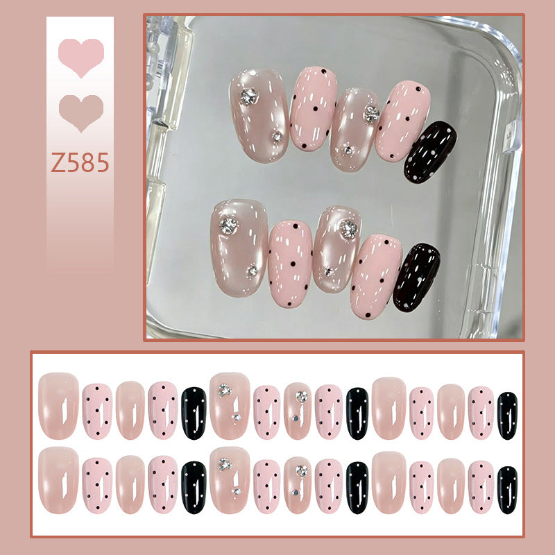 Acrylic nail set with glamorous rhinestone accents and modern dots Acalora