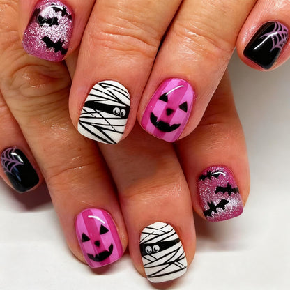 Creative nail art set with Halloween motifs and glitter accents Acalora