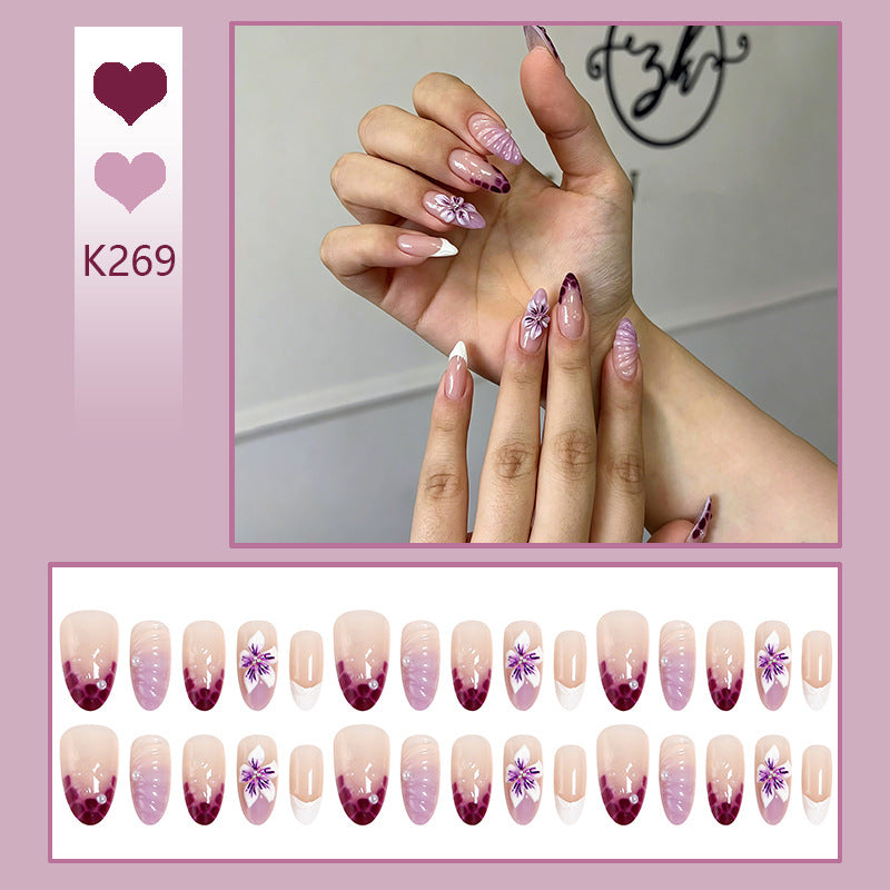 Artificial nail set with elegant ombre design and floral accents Acalora