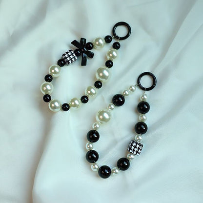 Elegant Pearl and Black Bead Charm Bracelet Acalora