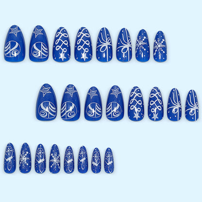 Artificial nails in festive winter design with glittering snowflakes and elegant decorations Acalora