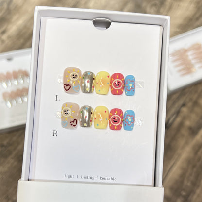 Whimsical Press-On Nail Art Set with Smiley Faces and Floral Designs Acalora