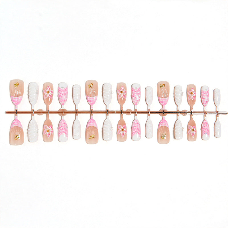 Artificial nail set with floral accents and glitter decorations Acalora