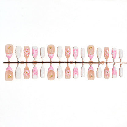 Artificial nail set with floral accents and glitter decorations Acalora