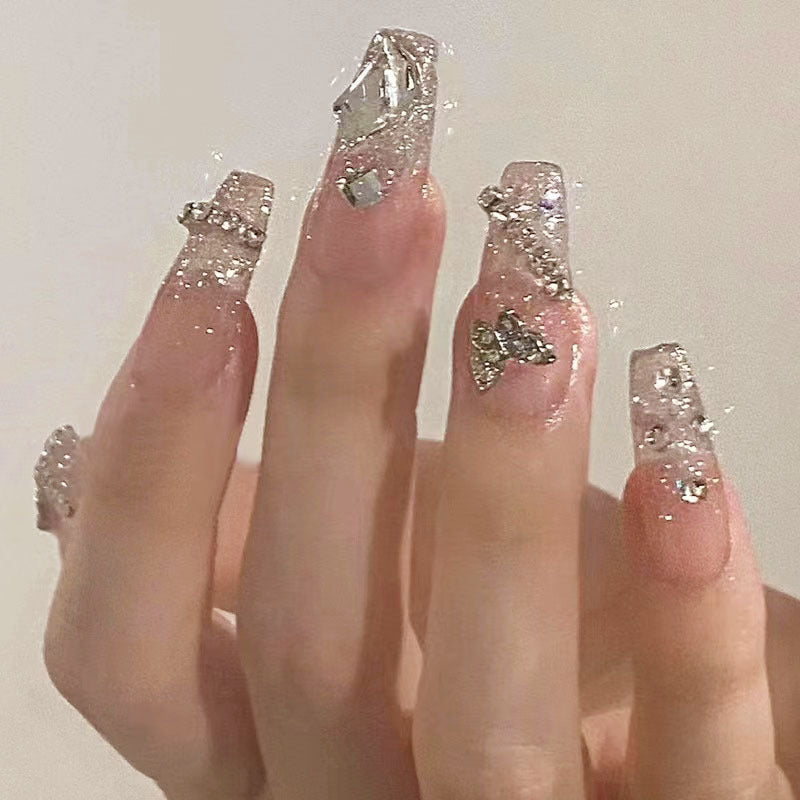 Glamorous artificial nails with sparkling rhinestones and elegant designs Acalora
