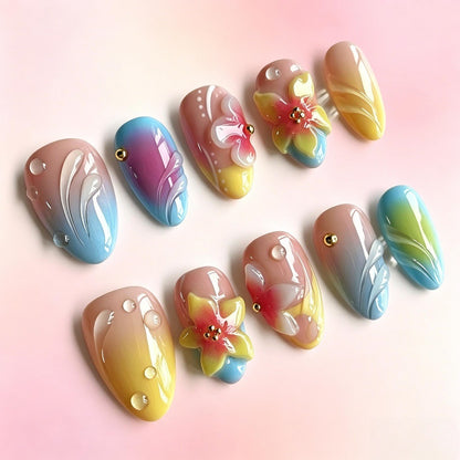 Acrylic nail set with floral elements and colorful accents Acalora