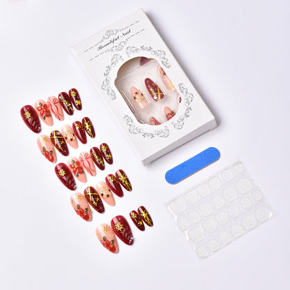 Artificial nail set in festive winter design with glamorous accents Acalora