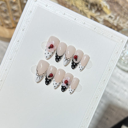 Artistic Stiletto Press-On Nail Set with Floral and Insect Designs Acalora