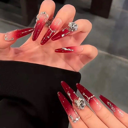 Artificial nails with elegant glitter and jewelry accents Acalora