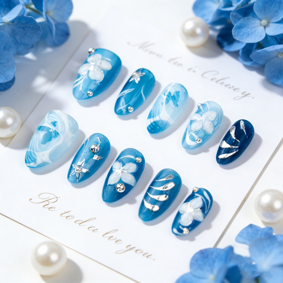 Artificial nail set with floral accents and elegant glitter elements Acalora