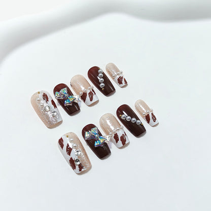 Artificial nails with glamorous 3D applications and glitter Acalora