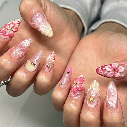 Artificial nail set with glamorous floral designs and creative glitter accents Acalora