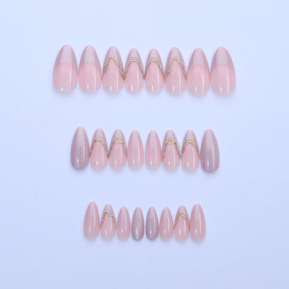 Acrylic nail set with glamorous tips and golden accents Acalora