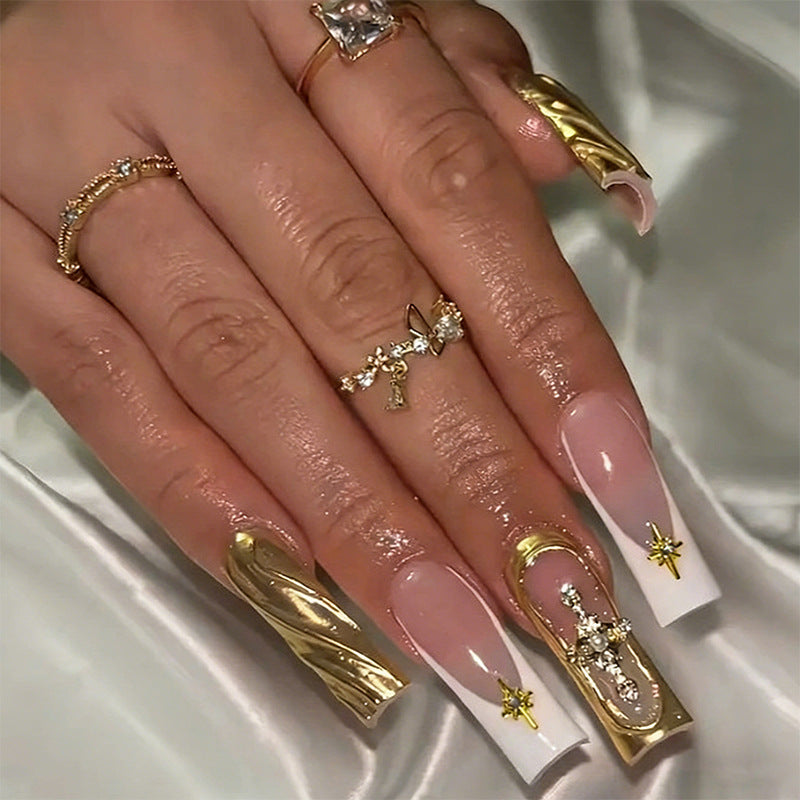 Acrylic nail set with elegant golden embellishments and glamorous accents Acalora