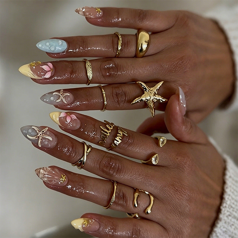 Artificial nail set with floral motifs and glitter accents Acalora