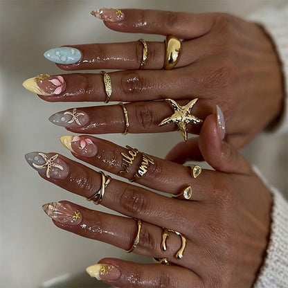 Artificial nail set with floral motifs and glitter accents Acalora