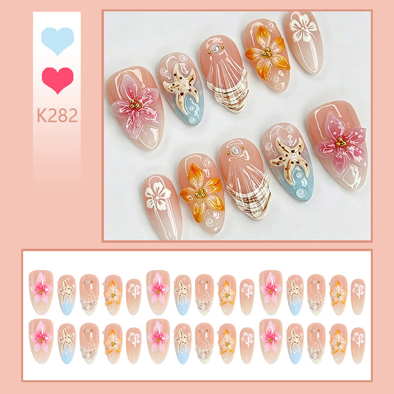 Artificial nail set with filigree flower and glitter details Acalora