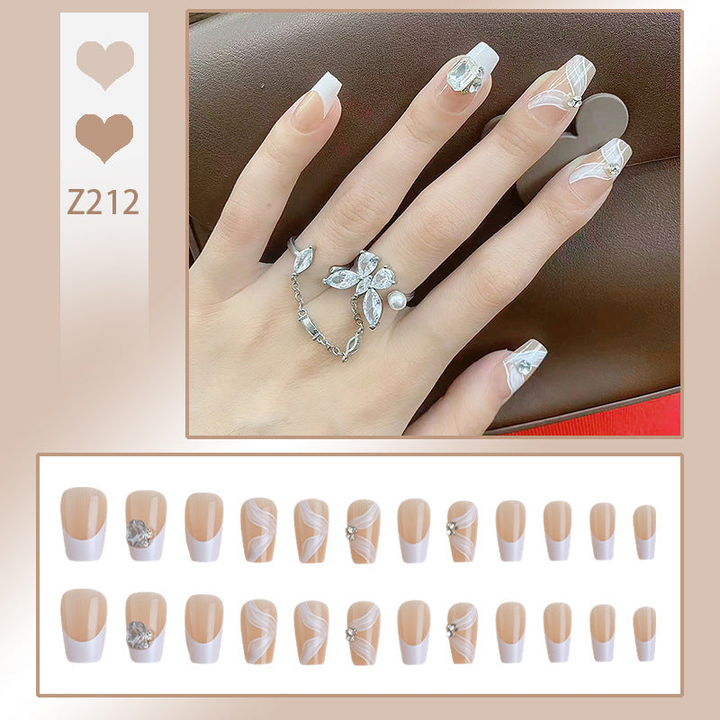 Elegant artificial nail set with delicate decorations and glitter elements Acalora