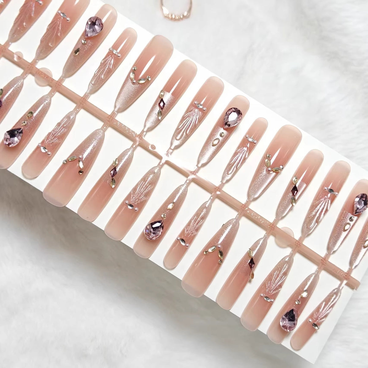 Artificial nails with glamorous crystal embellishments Acalora