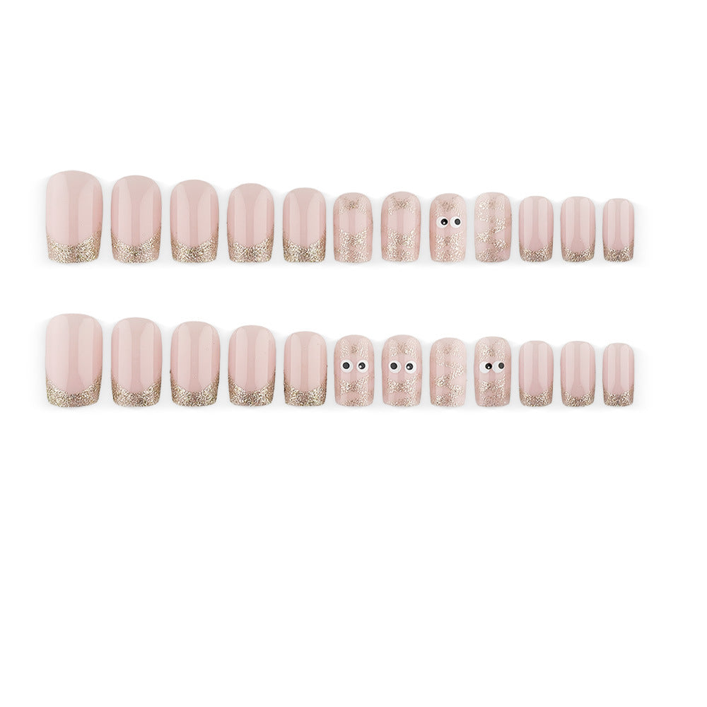 Artificials nails with playful eye design and glitter tips Acalora